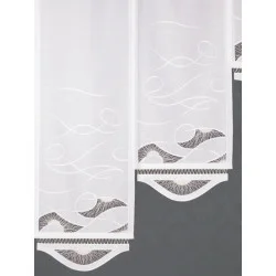 Exquisite Flächengardine mit Spitzenapplikationen und ansprechendem Bogenabschluß.