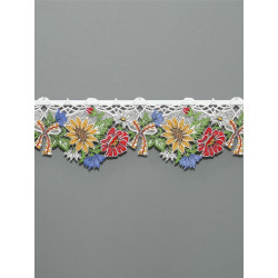 Nahaufnahme einer feinen Scheibengardine mit leuchtend gelben Sonnenblumen-Motiven.