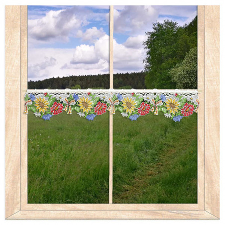 Gelbe Sonnenblumen-Stickerei aus Plauener Spitze als detailreiche Dekoration für Heimtextilien.