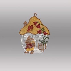 Freigestelltes Plauener Spitze Fensterbild mit einem bunten Pilzhaus und Osterhase vor grauem Grund.