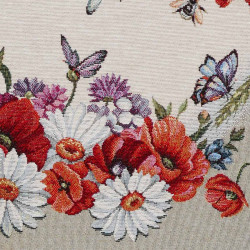 Nahaufnahme von strukturiertem Gobelinstoff mit filigran gewebtem Wildmohn-Motiv in Scharlachrot und Grün.
