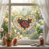 Fensterbild aus Plauener Spitze mit rosa Seerosen am Fenster dekoriert im Raumambiente.
